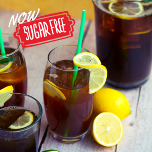 Image of sugar free peach iced tea glass with lemon garnish and straw