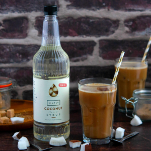 Image of coconut iced mocha with star and simply coconut syrup bottle in the background