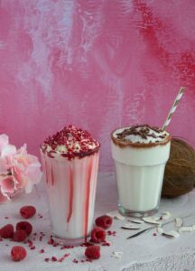 Raspberry frappe with raspberry sauce and coconut frappe dusted with chocolate